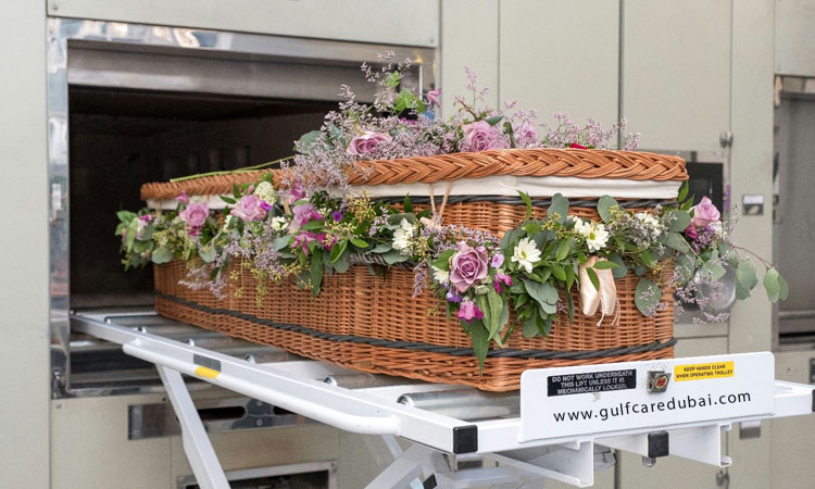 Coffin Going for Cremation with Flowers