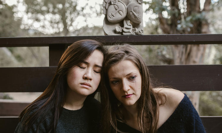 two women in a moment of grief